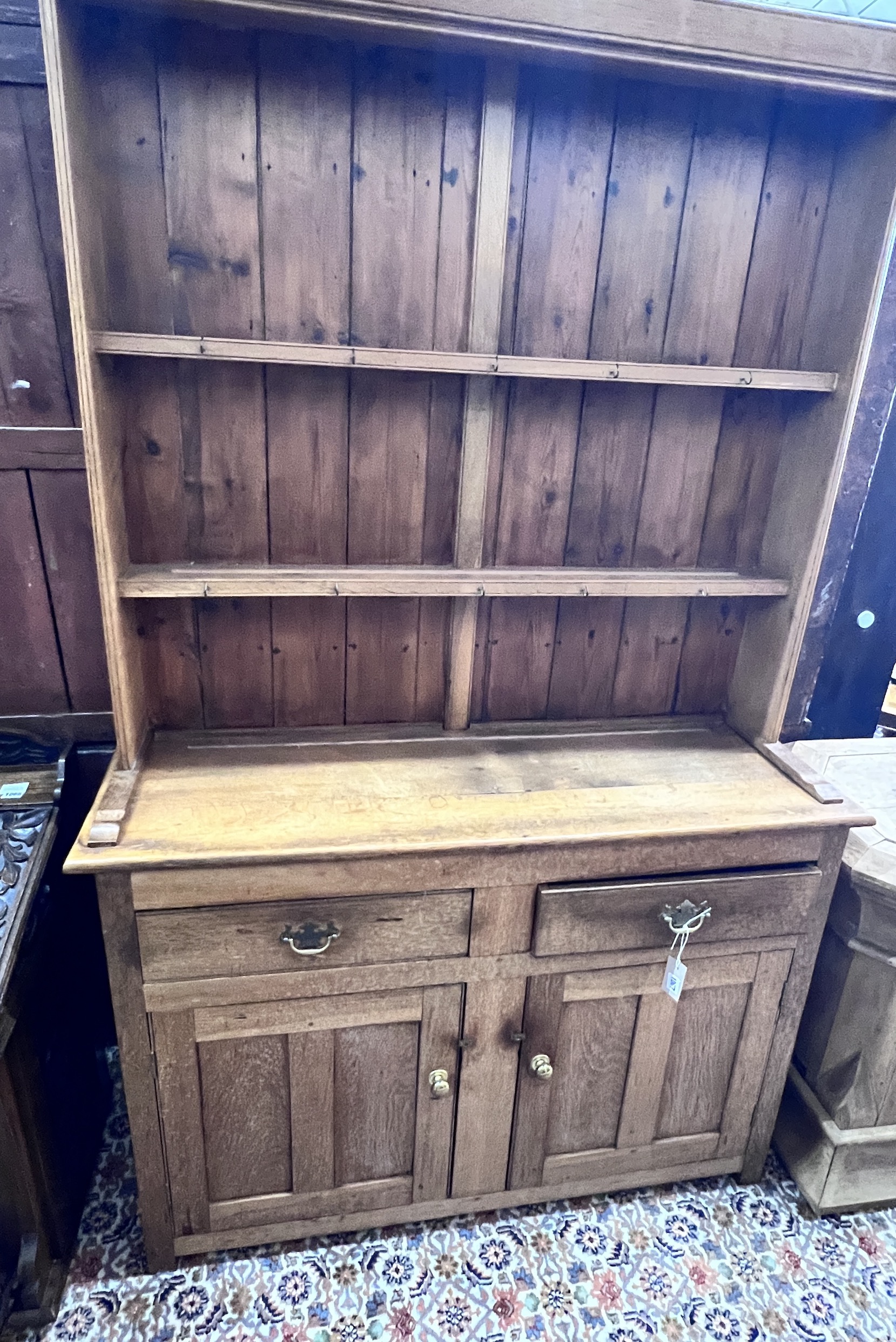 An early 20th century oak dresser, width 122cm, depth 39cm, height 194cm